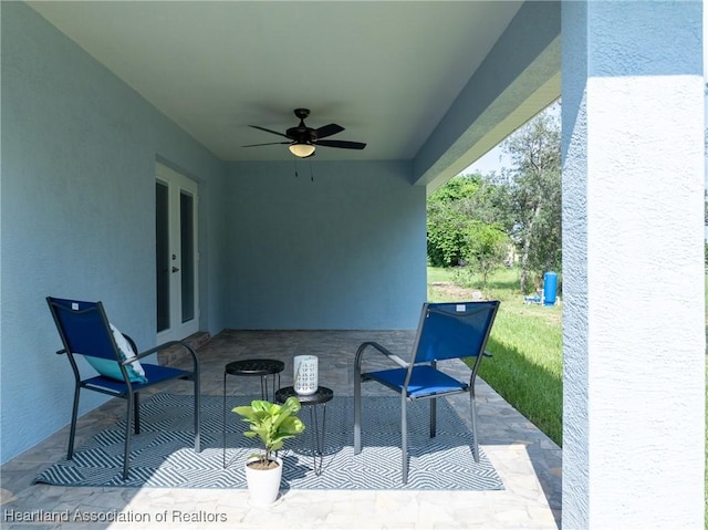 view of patio featuring ceiling fan