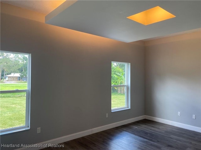 3900 Santiago St, Sebring, FL 33872 - spare room with baseboards and dark wood finished floors