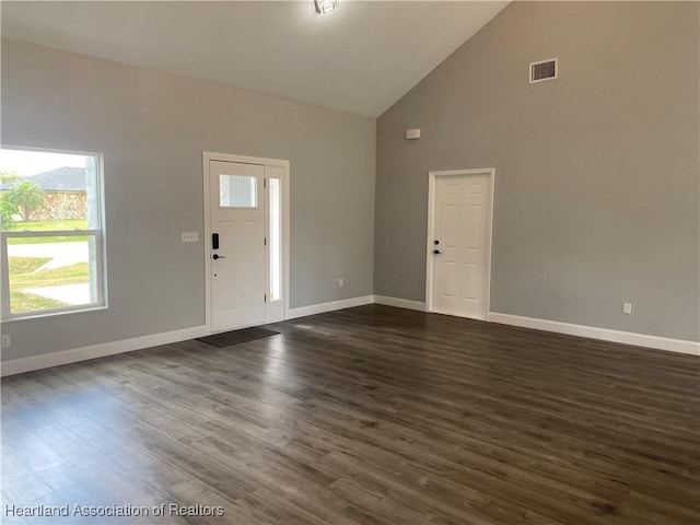 3900 Santiago St, Sebring, FL 33872 - foyer entrance with high vaulted ceiling and dark wood-style flooring
