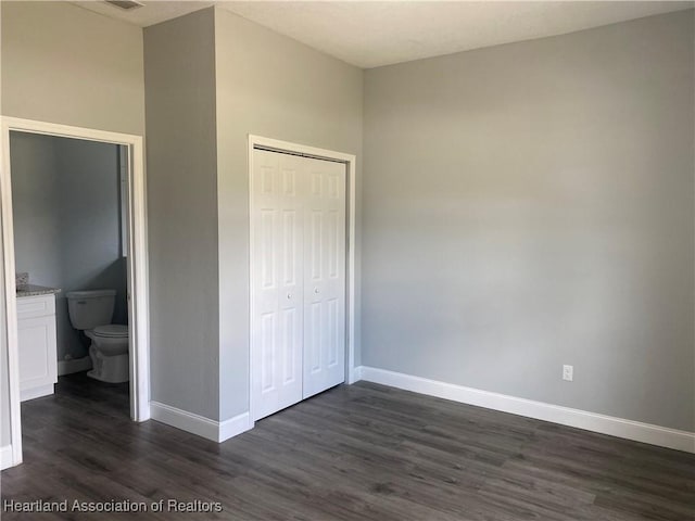 3900 Santiago St, Sebring, FL 33872 - unfurnished bedroom with dark wood-style floors and a closet
