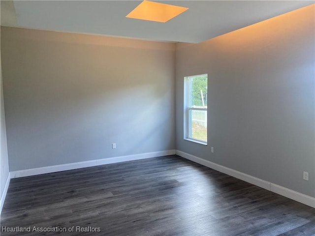 3900 Santiago St, Sebring, FL 33872 - empty room with dark wood-style flooring and baseboards