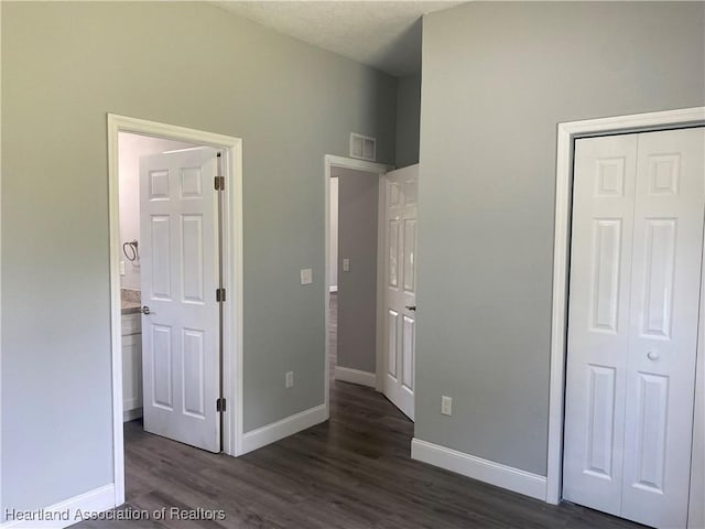 3900 Santiago St, Sebring, FL 33872 - unfurnished bedroom with dark wood-type flooring and a closet