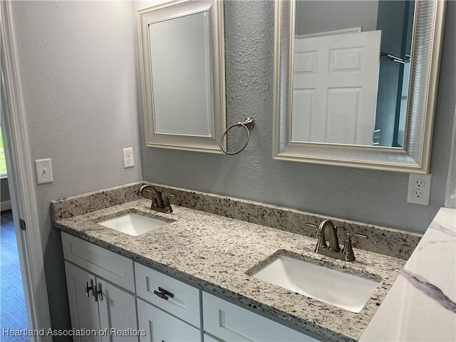 3900 Santiago St, Sebring, FL 33872 - full bathroom with double vanity and a textured wall