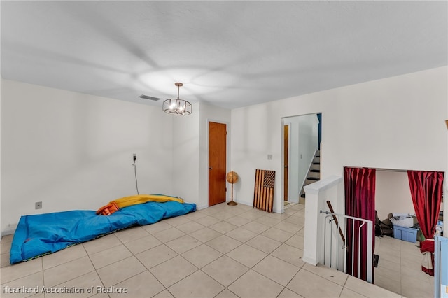 5324 Lafayette Ave, Sebring, FL 33875 - interior space featuring light tile patterned flooring, baseboards, visible vents, and an inviting chandelier