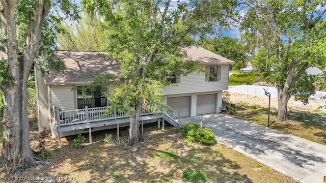 5324 Lafayette Ave, Sebring, FL 33875 - split level home with a garage, roof with shingles, and driveway