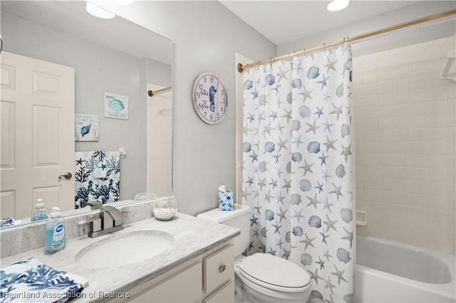 full bathroom with vanity, toilet, and shower / tub combo