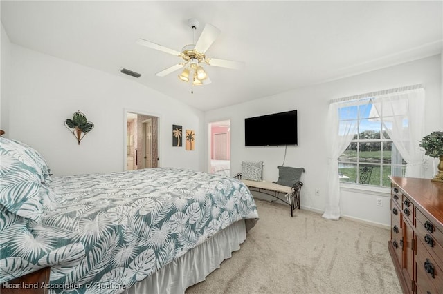 bedroom featuring ceiling fan, lofted ceiling, and light carpet