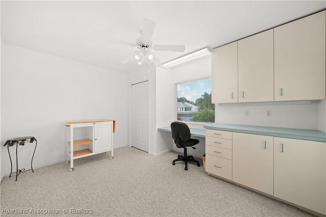 office area with light carpet and ceiling fan