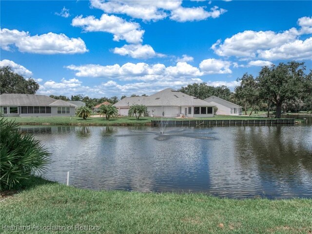 view of home's community featuring a lawn