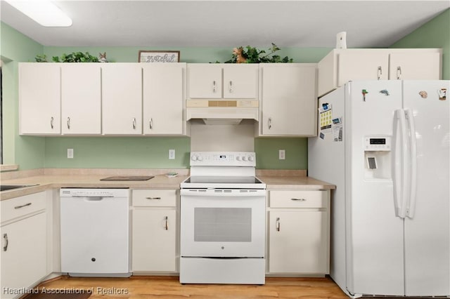 kitchen with white cabinetry and white appliances