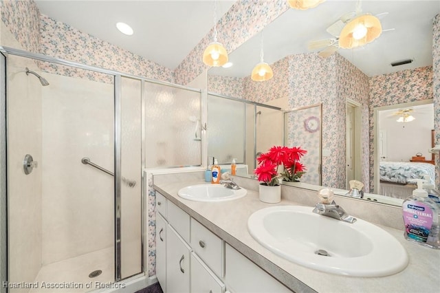 bathroom featuring lofted ceiling, an enclosed shower, and ceiling fan