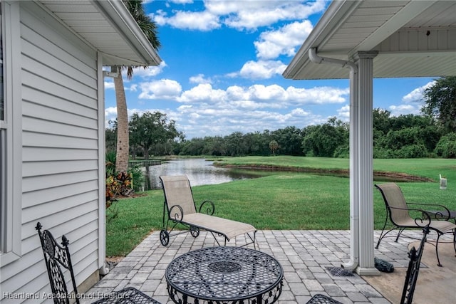 view of patio / terrace with a water view