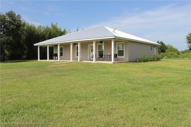 5195 Greenfields Run, Zolfo Springs, FL 33890 - farmhouse-style home featuring ceiling fan, a front yard, a patio, and stucco siding