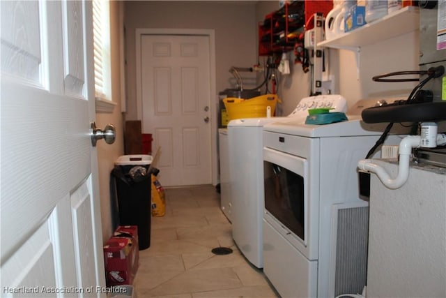 5195 Greenfields Run, Zolfo Springs, FL 33890 - washroom featuring washing machine and clothes dryer and light tile patterned flooring