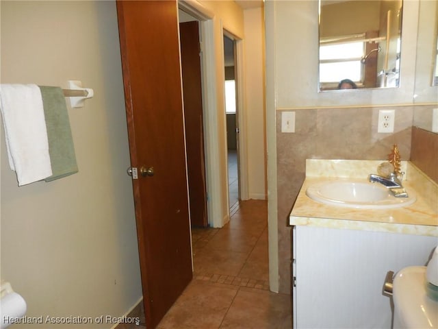 bathroom featuring tile patterned flooring and vanity