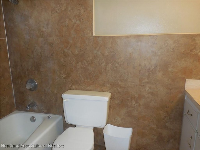 full bathroom featuring vanity, toilet, and bathtub / shower combination