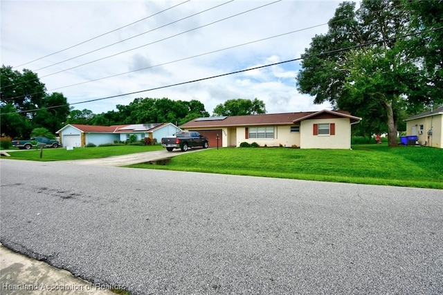 ranch-style house with a front lawn