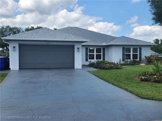 ranch-style home featuring a front lawn and a garage