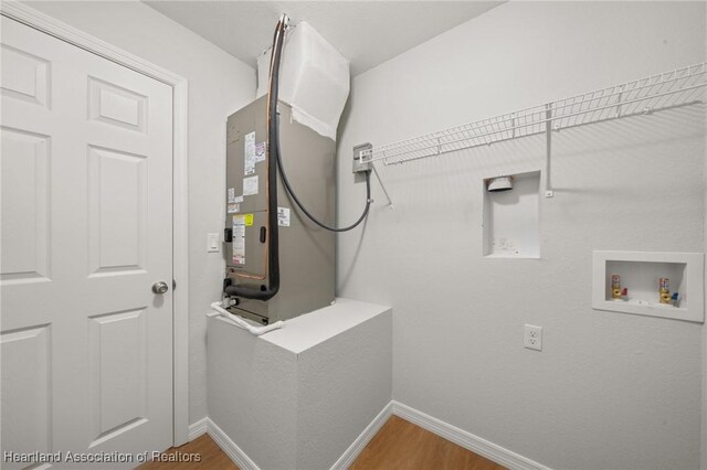 9131 Canter Path, Sebring, FL 33875 - washroom with hookup for a washing machine, wood finished floors, and electric dryer hookup