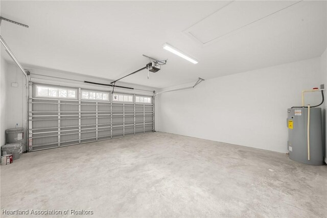 9131 Canter Path, Sebring, FL 33875 - garage with water heater and a garage door opener