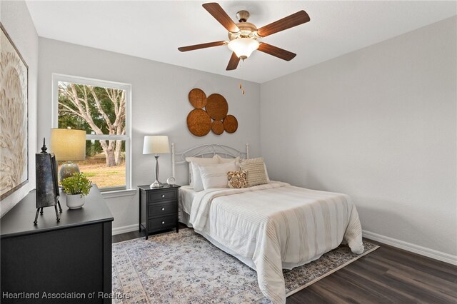 9131 Canter Path, Sebring, FL 33875 - bedroom featuring wood finished floors and a ceiling fan