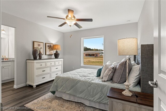 9131 Canter Path, Sebring, FL 33875 - bedroom featuring dark wood-style floors, ensuite bathroom, and a ceiling fan