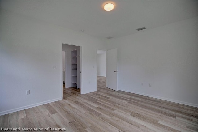 unfurnished room featuring light wood-type flooring