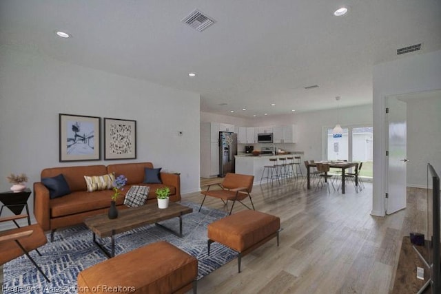 living room featuring light hardwood / wood-style floors