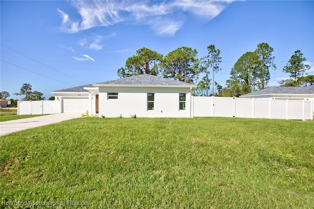 view of front of property with a garage and a front lawn