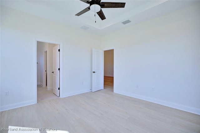 unfurnished room featuring ceiling fan and light wood-type flooring