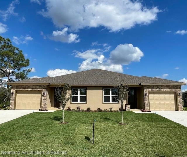 ranch-style home with a garage and a front lawn