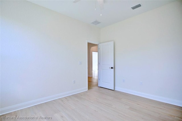 unfurnished room with ceiling fan and light hardwood / wood-style flooring