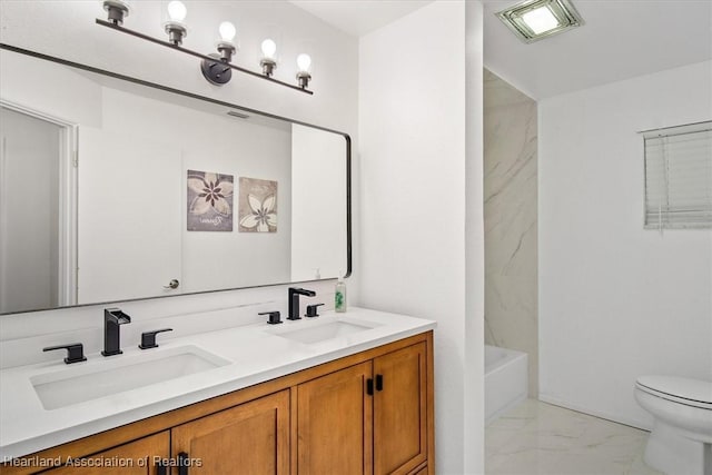 full bathroom featuring vanity, toilet, and bathing tub / shower combination