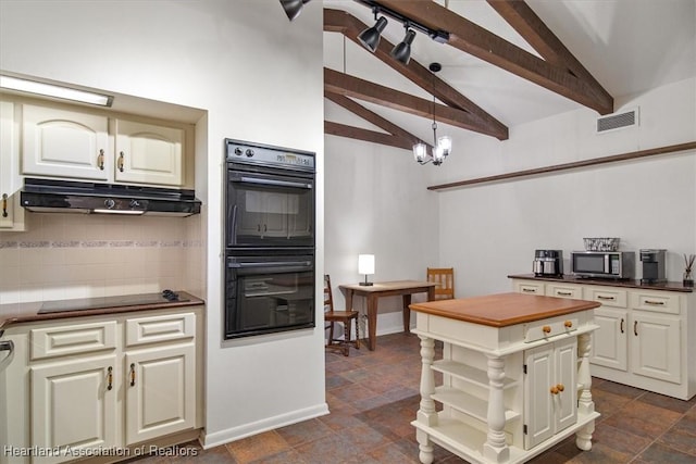 kitchen with decorative light fixtures, vaulted ceiling with beams, backsplash, black appliances, and cream cabinetry