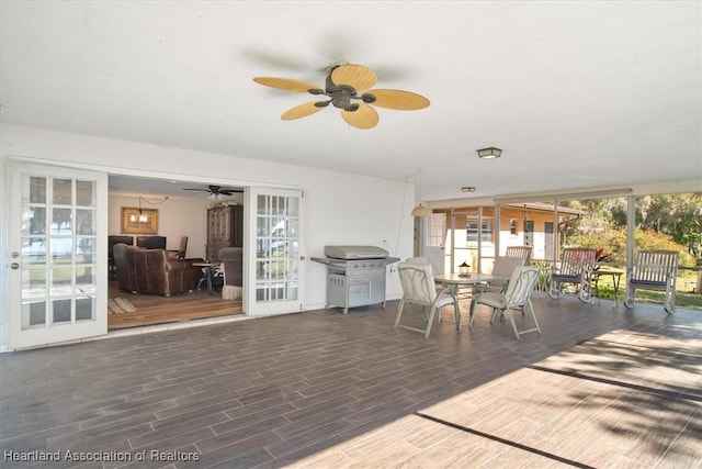 interior space with a grill and ceiling fan