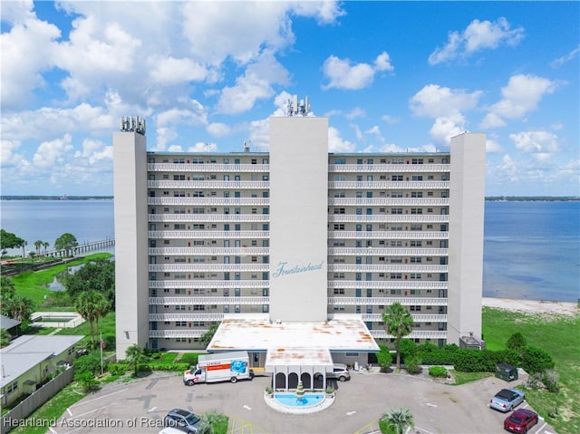2131 Lakeview Dr Unit 1008, Sebring, FL 33870 - view of apartment building / complex with a water view and uncovered parking