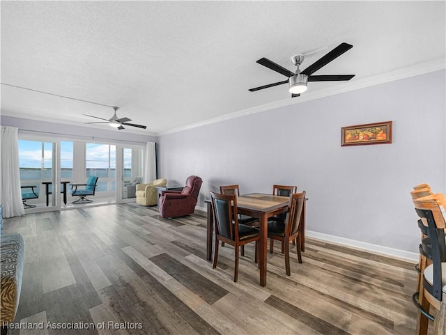 2131 Lakeview Dr Unit 1008, Sebring, FL 33870 - dining room featuring a ceiling fan, wood finished floors, a textured ceiling, and ornamental molding