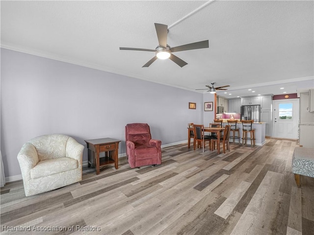 2131 Lakeview Dr Unit 1008, Sebring, FL 33870 - living area featuring ceiling fan, light wood-type flooring, and ornamental molding