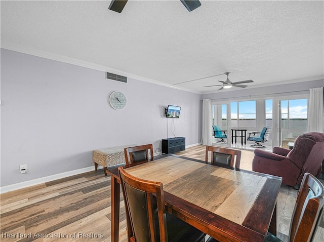 2131 Lakeview Dr Unit 1008, Sebring, FL 33870 - dining space featuring a ceiling fan, a textured ceiling, ornamental molding, and light wood finished floors