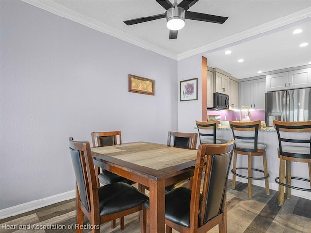 2131 Lakeview Dr Unit 1008, Sebring, FL 33870 - dining room featuring dark wood-style flooring, crown molding, recessed lighting, and ceiling fan