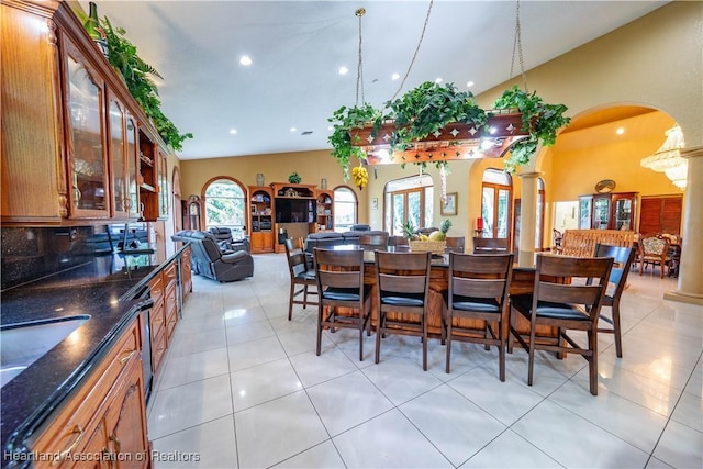 14630 Luray Rd, Southwest Ranches, FL 33330 - dining area with arched walkways, ornate columns, light tile patterned flooring, recessed lighting, and high vaulted ceiling