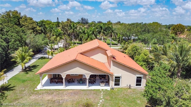 14630 Luray Rd, Southwest Ranches, FL 33330 - rear view of property with stucco siding, a yard, a patio area, and metal roof