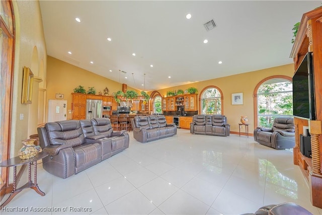 14630 Luray Rd, Southwest Ranches, FL 33330 - living area featuring light tile patterned floors, vaulted ceiling, and recessed lighting