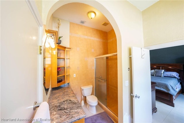 14630 Luray Rd, Southwest Ranches, FL 33330 - ensuite bathroom featuring toilet, tile patterned floors, a stall shower, and vanity