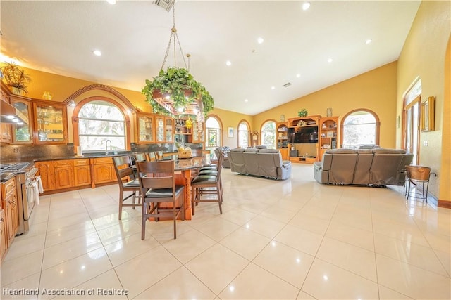 14630 Luray Rd, Southwest Ranches, FL 33330 - dining space with light tile patterned floors, recessed lighting, and high vaulted ceiling