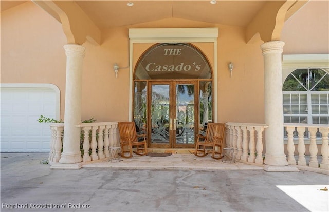 14630 Luray Rd, Southwest Ranches, FL 33330 - entrance to property with french doors, a garage, and stucco siding
