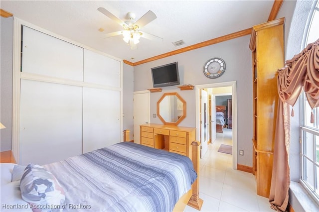 14630 Luray Rd, Southwest Ranches, FL 33330 - bedroom featuring ornamental molding, light tile patterned flooring, a closet, and ceiling fan