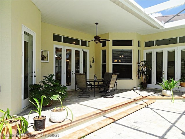 view of patio featuring ceiling fan and french doors