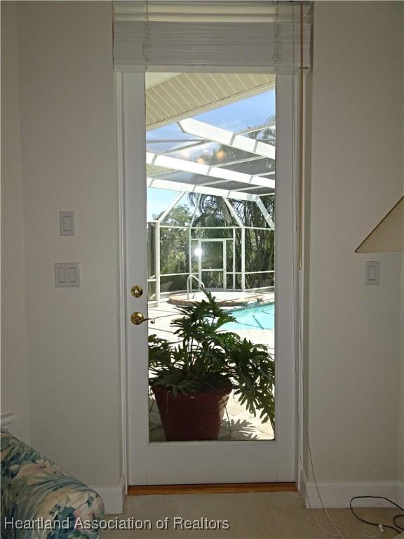 entryway with a sunroom and baseboards