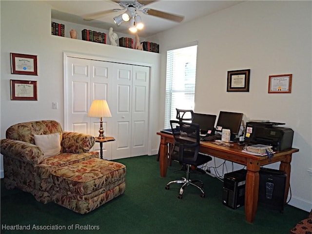 carpeted office space with ceiling fan